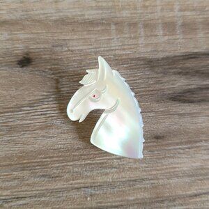 Vintage mother of pearl horse head brooch.